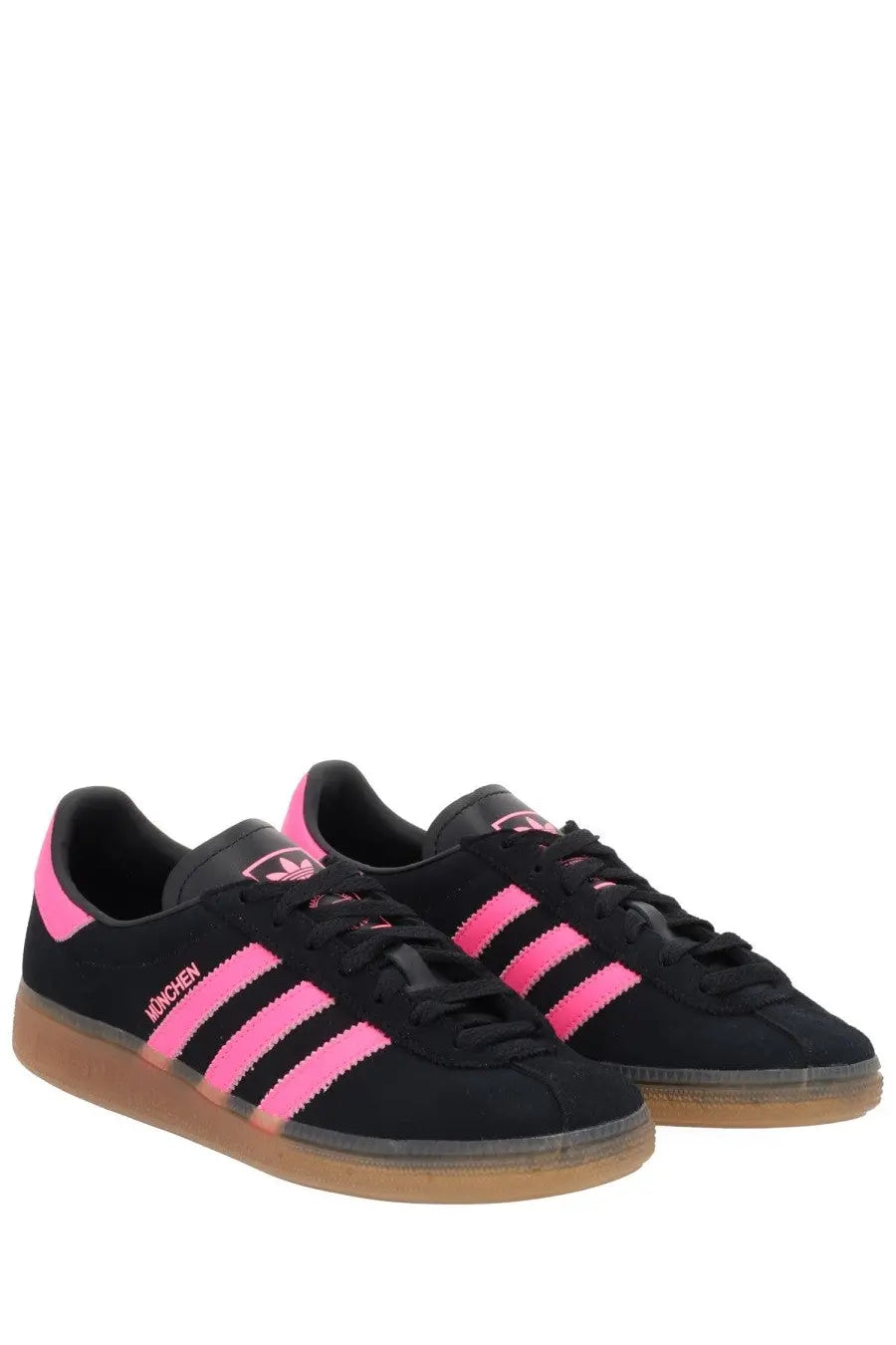 Adidas women’s sneaker muenchen in black suede with vibrant pink stripes and gum rubber sole shown from back view