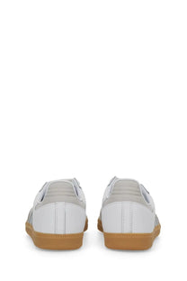 Adidas women’s sneaker Samba white leather with tan rubber soles and subtle gray stripes on the sides