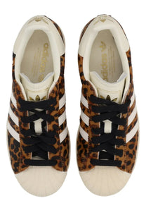 Adidas women’s superstar ii sneaker in leopard print with white rubber toe caps and black laces multicolor design