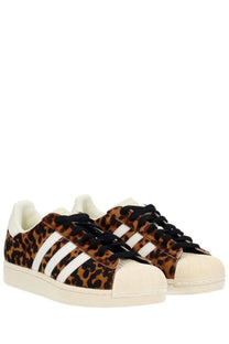 Adidas women’s superstar ii sneaker in leopard print with white stripes and black laces in multicolor design