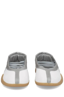 Adidas women’s taekwondo mei sneaker white low-top with silver accents and gum rubber sole for martial arts use