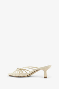 Aeyde women’s Abby leather sandals in cream with slender heel and crisscross straps for stylish wear