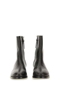 Aeyde women’s black leather ankle boots with sleek minimalist design and functional side zippers