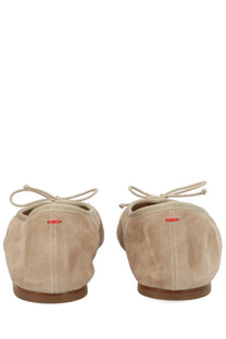 Beige suede ballet flats with tied laces and a subtle red logo on the heel from Aeyde Women’s Dancer Dolphin Beige