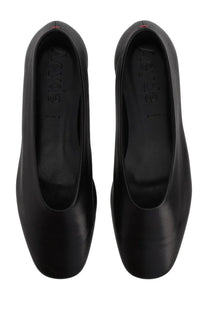 Black leather aeyde women’s dancer kirsten ballet flats with sleek minimalist design and red stitching at the heel back view