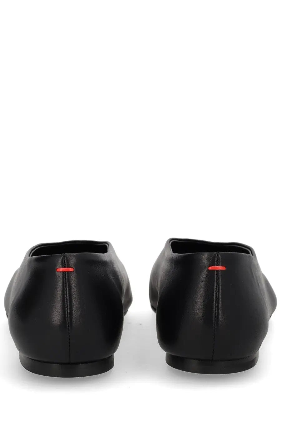 Aeyde women’s dancer Kirsten black leather ballet flats shown from the back with subtle red stitching detail at the heel