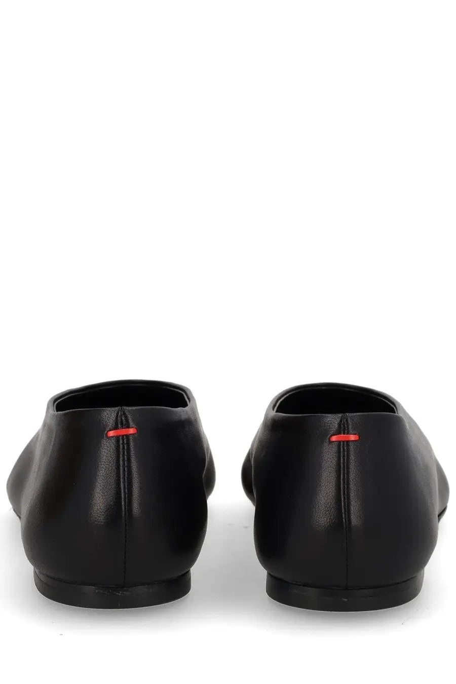 Aeyde women’s Dancer Kirsten black leather loafers shown from the back with subtle red stitching detail at the heel