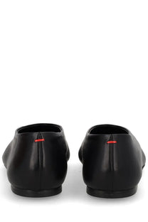 Aeyde women’s Dancer Kirsten black leather loafers shown from the back with subtle red stitching detail at the heel