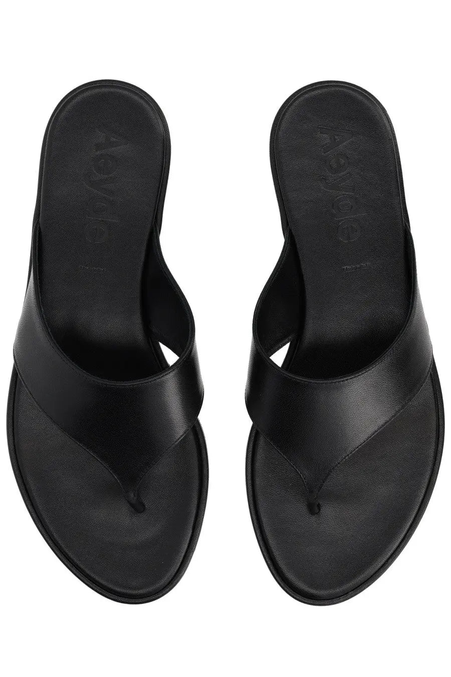 Black leather flip-flops by aeyde with a sleek minimalist design and aleya embossed on the insole
