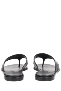 Aeyde women’s black leather thong sandal with a minimalist design and flat sole for casual wear