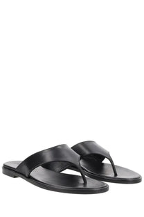 Aeyde women’s black leather thong sandals with minimalist design and flat sole perfect for casual wear