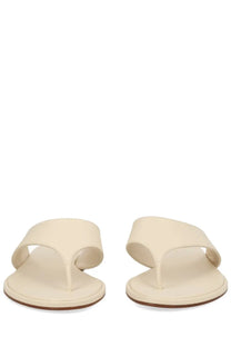 Aeyde women’s cream-colored leather thong sandal with minimalist design and flat sole in white