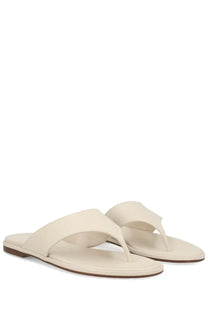 Aeyde women’s cream-colored leather thong sandal with minimalist design and flat sole in white color