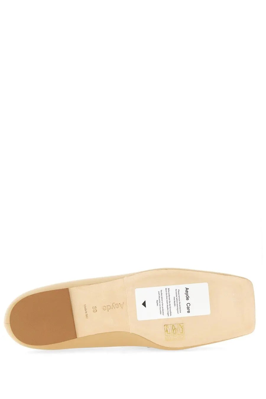 Beige leather sole of aeyde women’s moccasin tom with white care label and size 39 marking visible on the back side