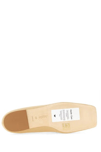 Beige leather sole of aeyde women’s moccasin tom with white care label and size 39 marking visible on the back side