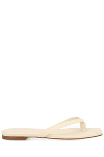 Aeyde women’s sandalo renee white cream-colored flat thong sandal with minimalist design and brown rubber sole