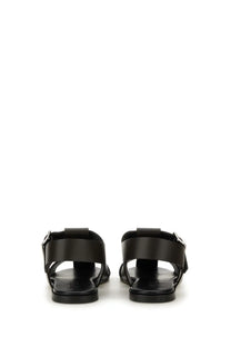 Aeyde women’s black leather sandals with minimalist design and silver-toned buckle accents