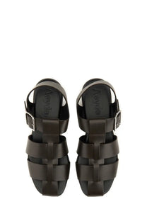 Aeyde women’s black leather sandals with woven strap design and silver-toned buckle accents