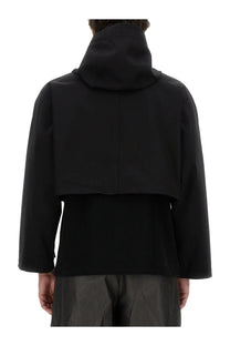Aïe men’s cropped black hooded jacket with minimalist two-layer design and sleek structured shoulders