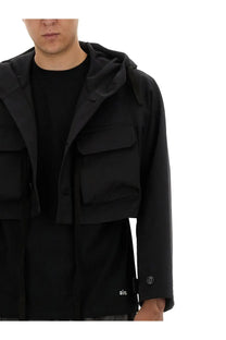 AïE men’s black jersey shirt with hood multiple flap pockets and subtle brand logo on the sleeve