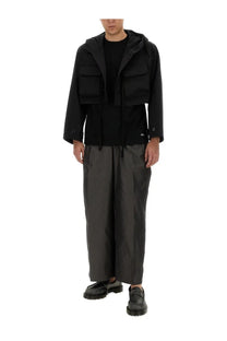 Aïe men’s black jersey shirt with sleek modern design and multiple flap pockets in a hooded jacket style