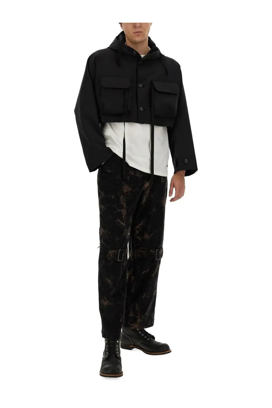 Aïe men’s white jersey shirt paired with a black hooded jacket featuring two front flap pockets and button closures