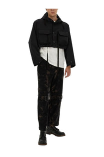Aïe men’s white jersey shirt paired with a black hooded jacket featuring two front flap pockets and button closures