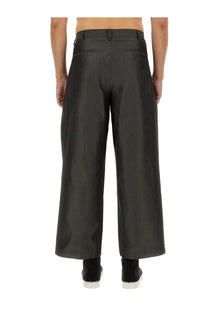 Black wide-leg trousers with sleek modern cut and subtle creases from AïE men’s wide fit pants grey collection