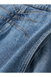 Alaïa women’s blue denim jeans in medium wash with visible stitching and slightly worn texture on front side