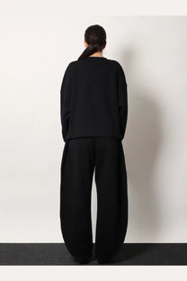 Alaïa women’s boatneck black cotton sweatshirt with oversized knit, relaxed fit, and long sleeves