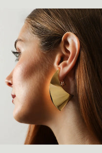 Alaïa womens brass earrings in gold with a sleek modern design and geometric statement shapes
