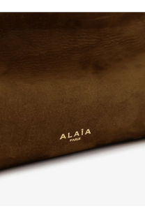 Brown suede clutch with gold foil alaïa paris branding for a women’s leather shoulder bag in green