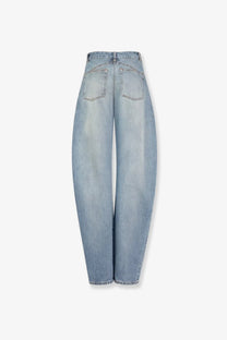 Alaïa women’s faded blue light-wash denim jeans with high-rise wide-leg cut and classic back pockets shown from back