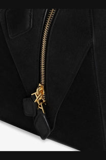 Alaïa women’s black nubuck shoulder bag with gold-tone zipper and matching leather pull tabs