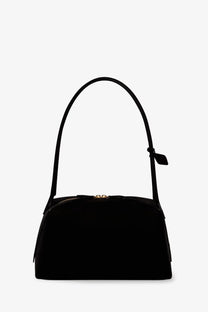 Alaïa women’s le bouledogue black nubuck shoulder bag with a curved top handle and gold-tone zipper closure