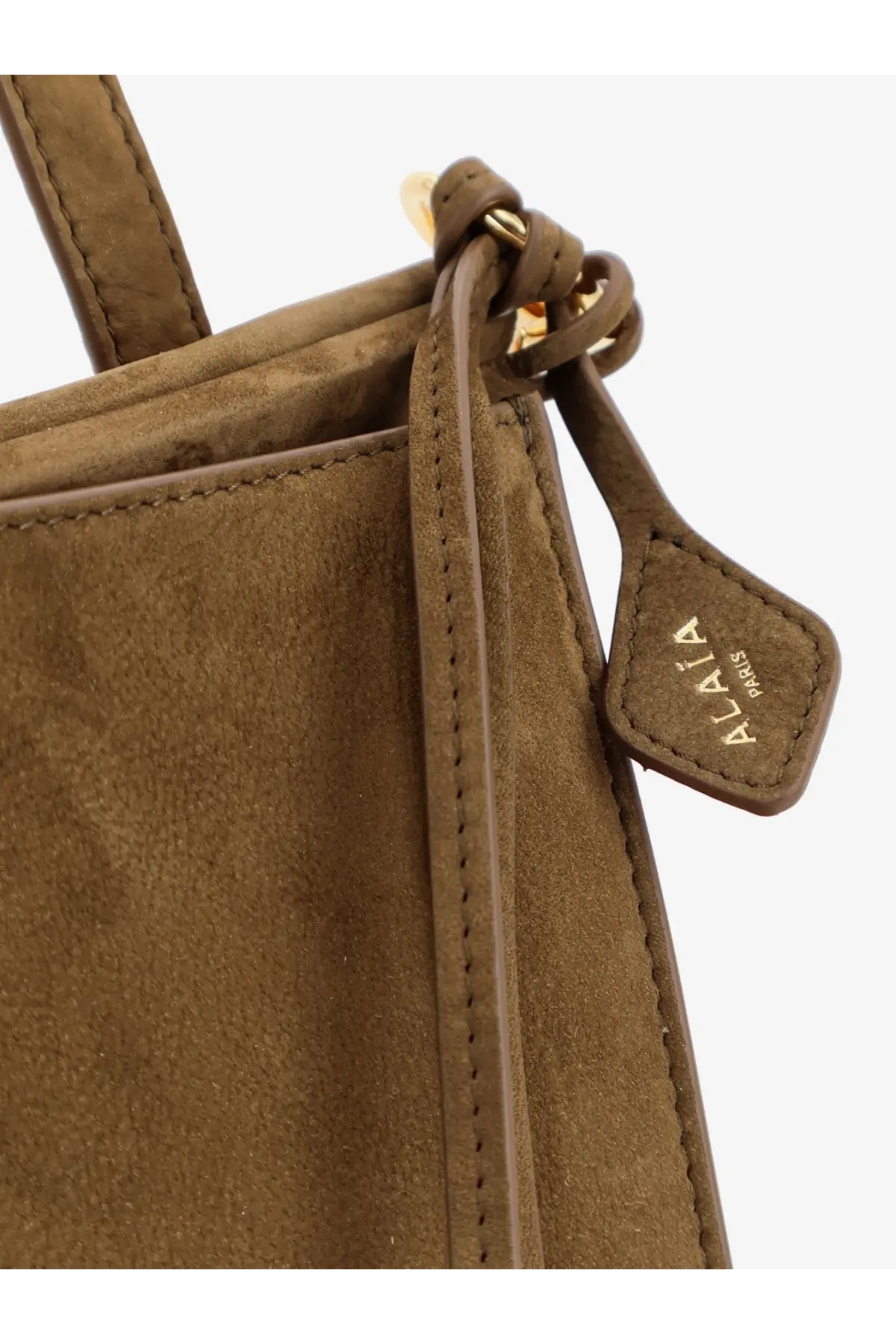 Alaïa women’s le click pocket nabuck shoulder bag in taupe suede with gold zipper pull and alia paris leather tag