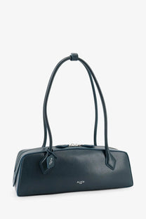Alaïa women’s le teckel black leather shoulder bag with sleek elongated design and matching handles