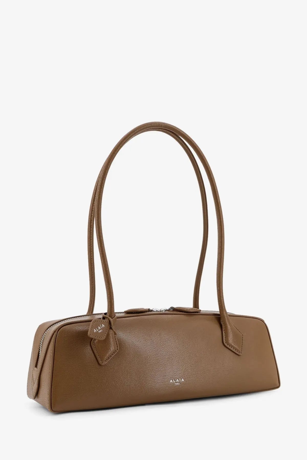 Alaïa women’s green leather shoulder bag with sleek tan leather and curved top handles minimalist design