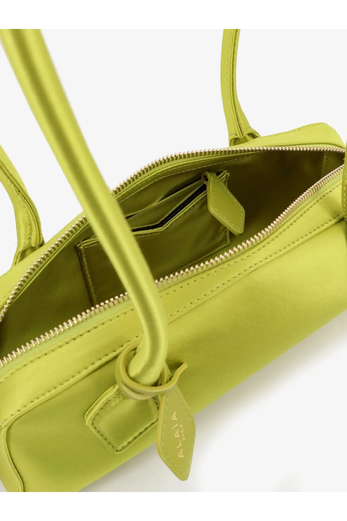 Alaïa women’s le teckel satin shoulder bag green with sleek lime green leather handles and gold-toned zipper lining