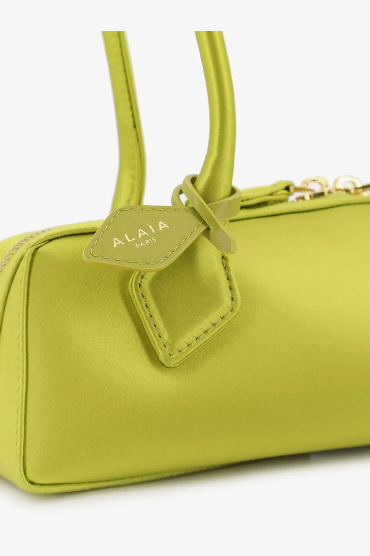 Alaïa women’s le teckel satin shoulder bag in vibrant lime green smooth leather with gold hardware and branded alaïa paris tag