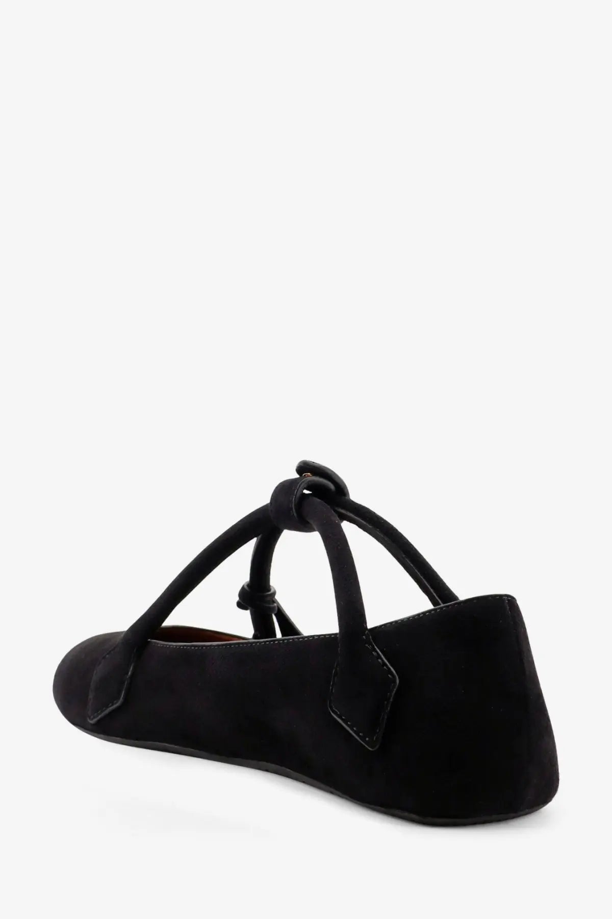 Alaïa women’s le teckel black suede mary jane flat shoe showing the tied bow detail on the back side