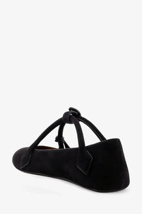 Alaïa women’s le teckel black suede mary jane flat shoe showing the tied bow detail on the back side