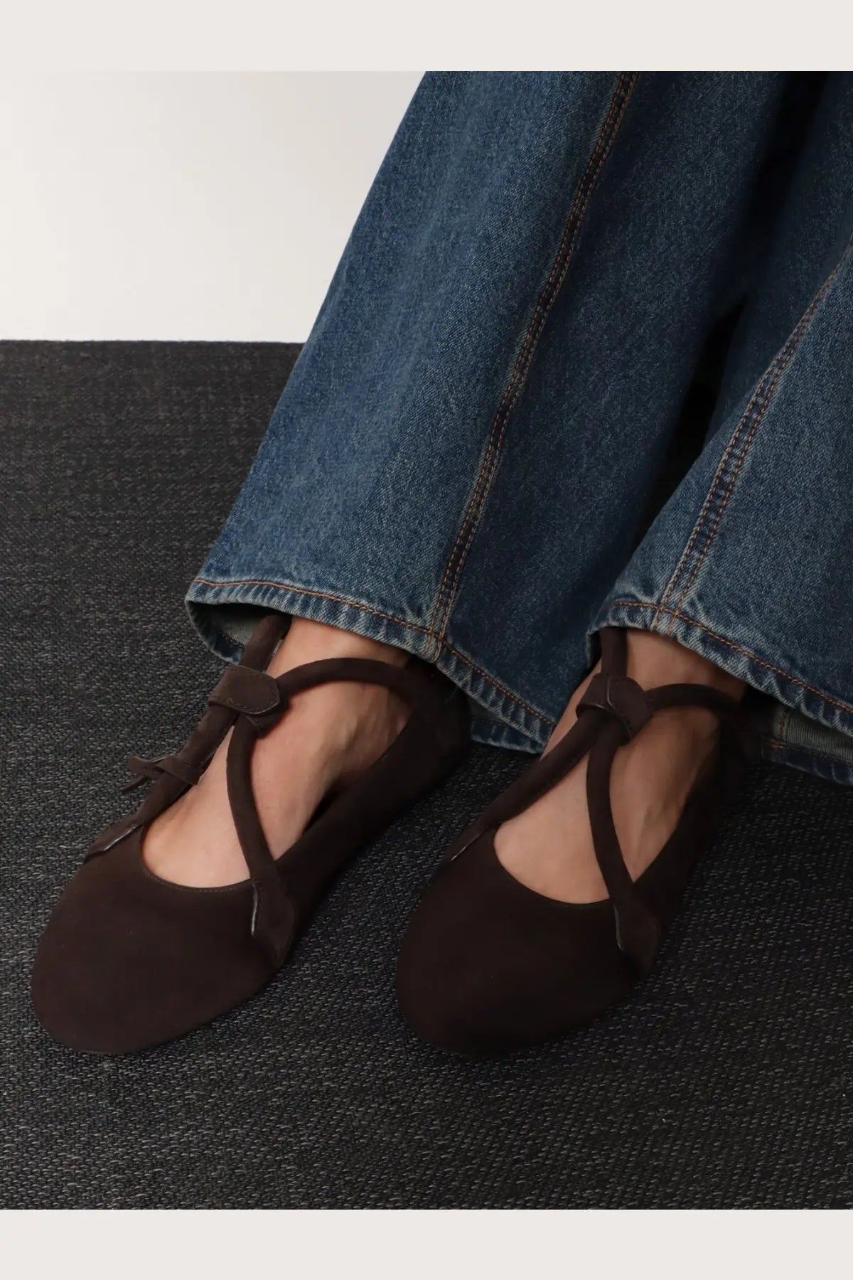 Alaïa women’s le teckel brown suede ballet flats with delicate crisscross straps and small bows