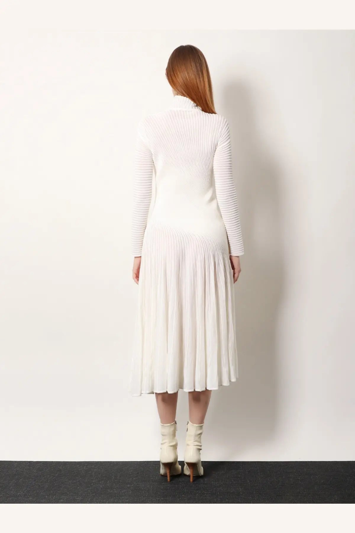 Alaïa women’s white long wool dress with a high neckline ribbed knit top and pleated midi skirt