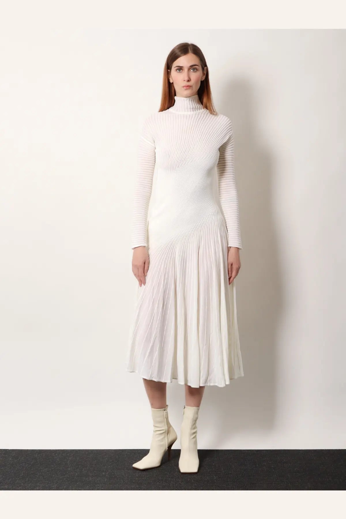 Alaïa women’s white long wool dress with long sleeves high turtleneck and pleated midi skirt