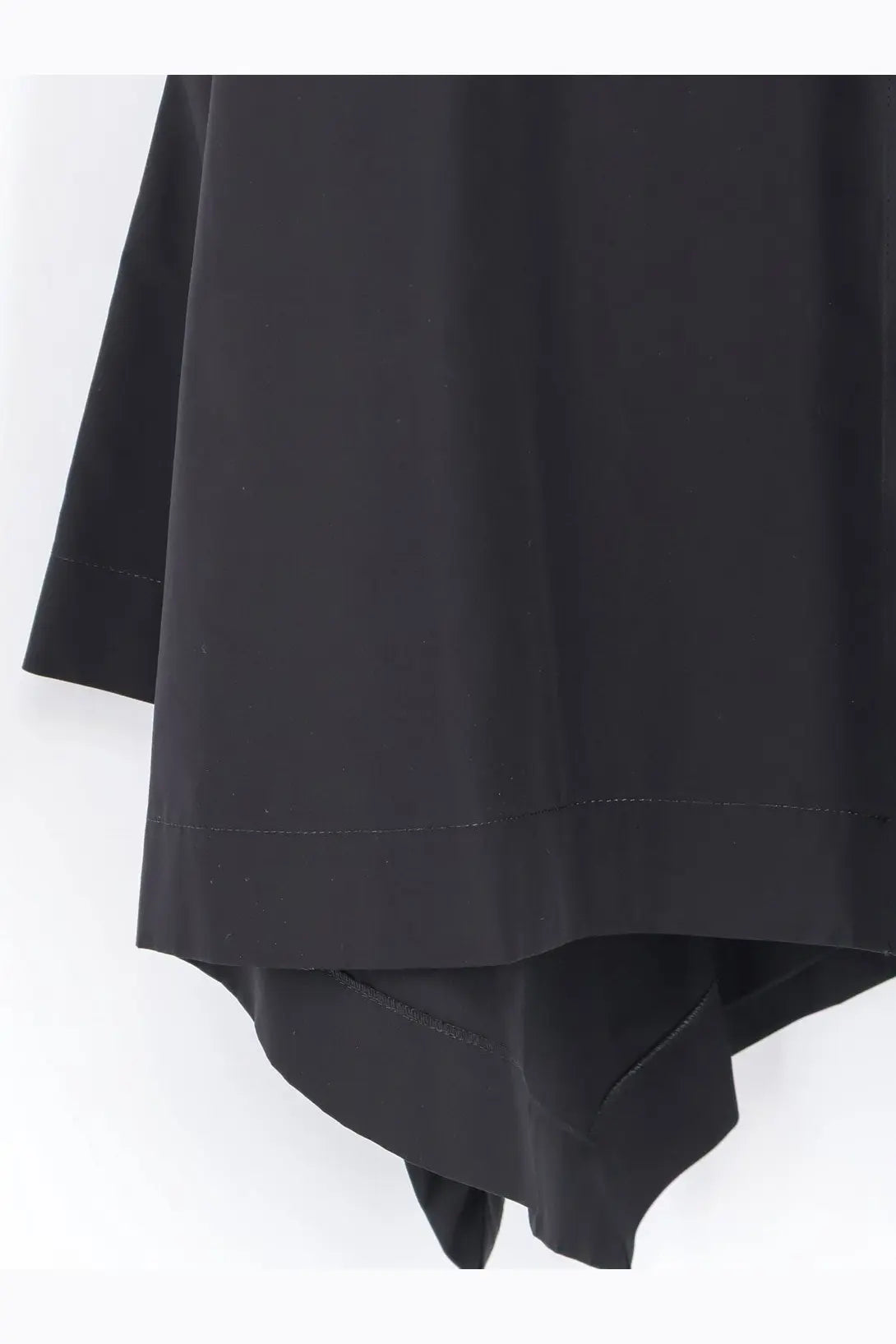 Alaïa women’s panelled cotton dress black featuring a smooth flowing black skirt with a clean hemline