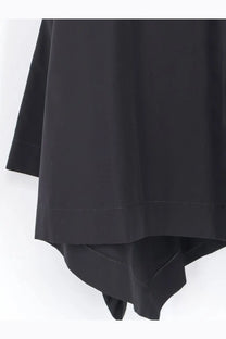 Alaïa women’s panelled cotton dress black featuring a smooth flowing black skirt with a clean hemline