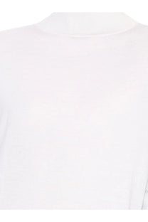 Alaïa women’s white crew-neck peplum sweater made of virgin wool with soft smooth fabric texture