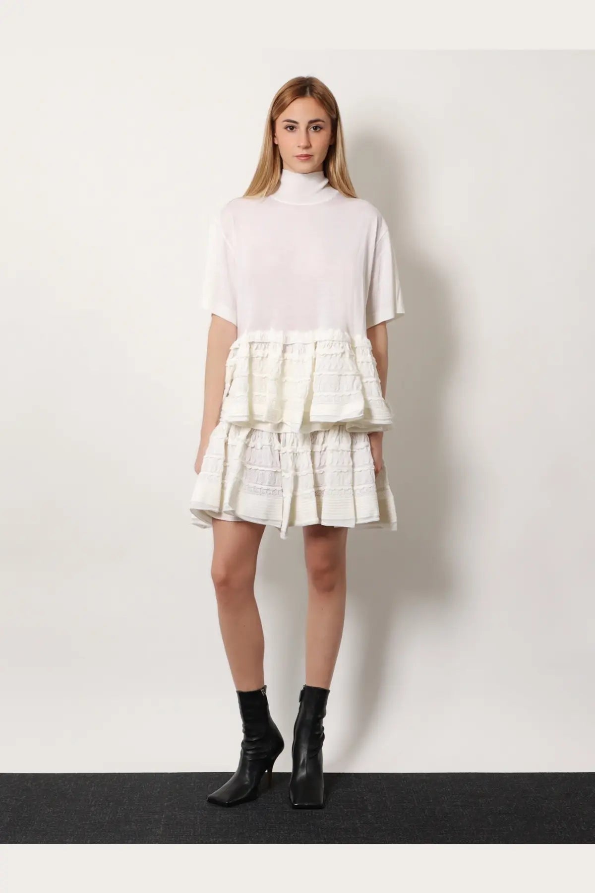 Alaïa women’s white tiered dress with high neckline short sleeves and ruffled textured fabric layers