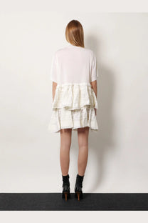 Alaïa women’s white tiered dress with sheer short sleeves and ruffled textured skirt in virgin wool blend
